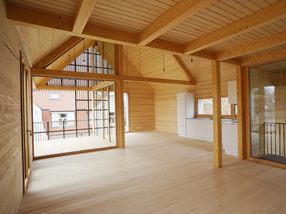 Stadt-Holzhaus Konstanz: prämiertes Holzrahmenbau Wohnhaus mit Schieferdach — Nachverdichtung, ökologische Ausrichtung.